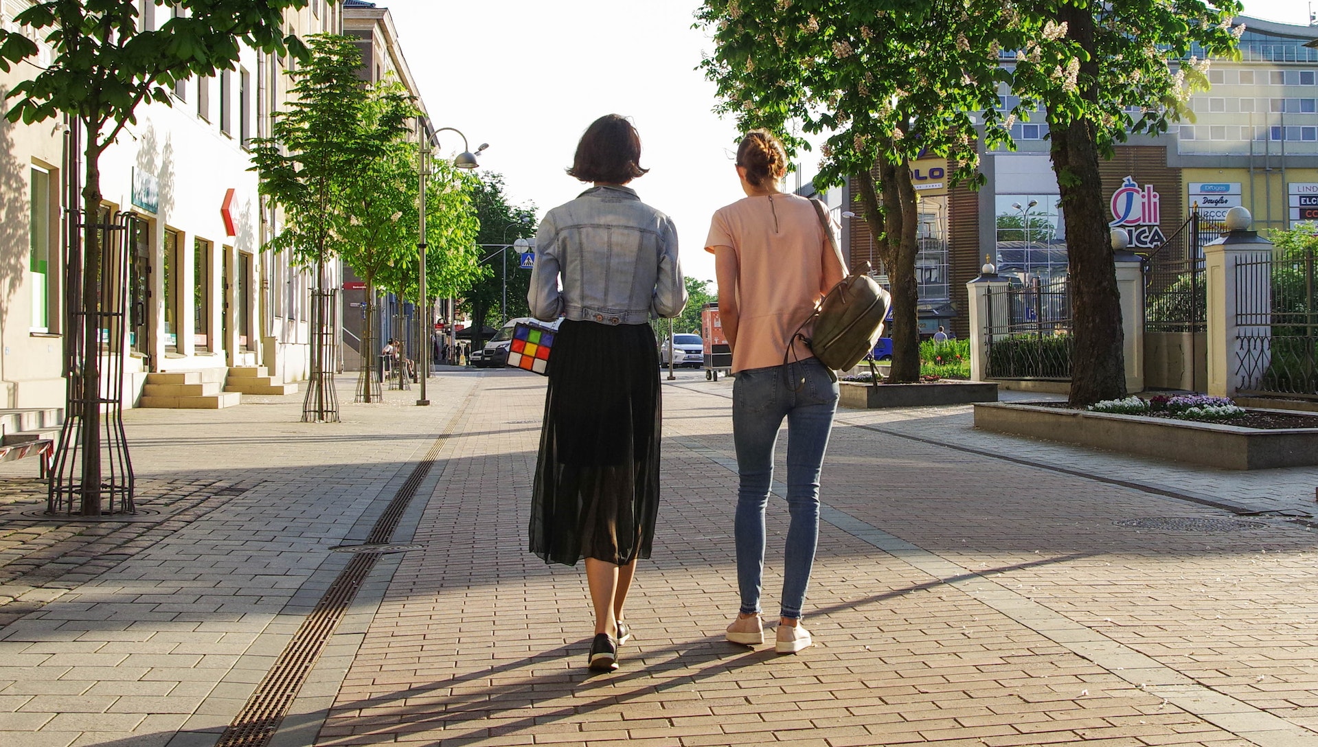 photo-of-women-walking-down-the-street